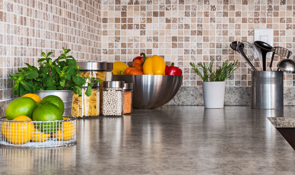 Kitchen countertop with food ingredients and herbs